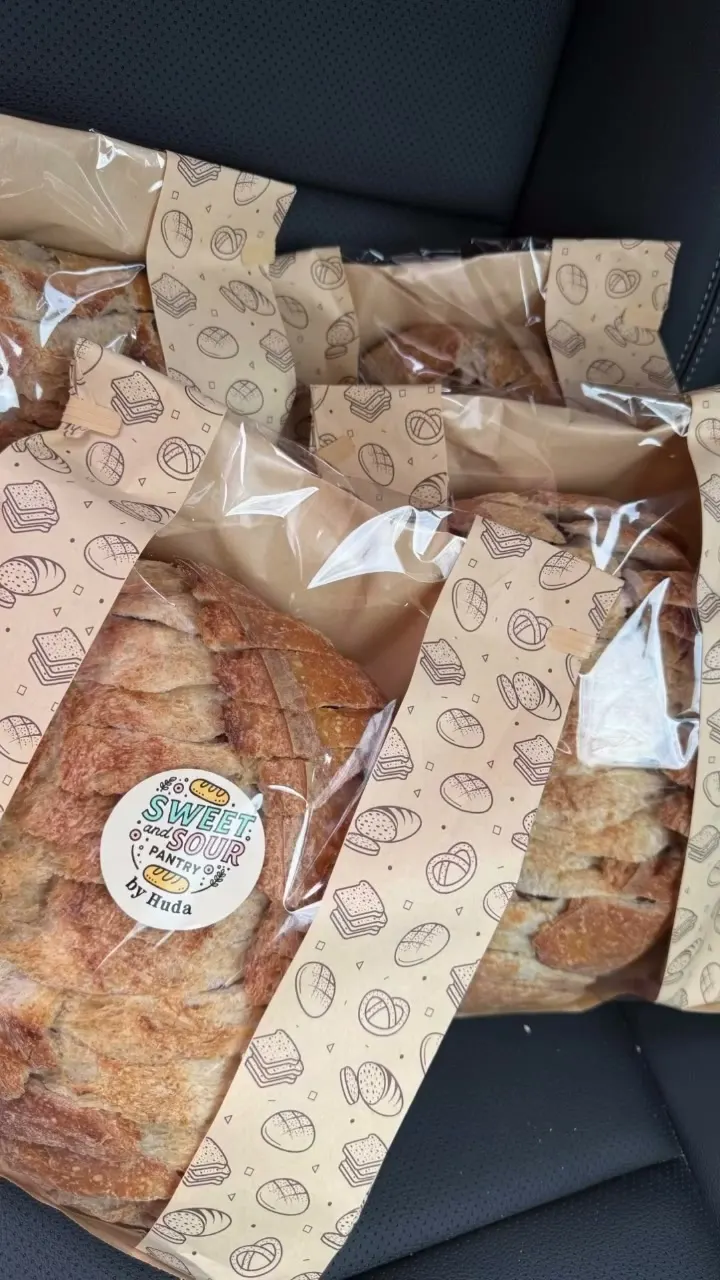 Sliced sourdough packed in a printed paper bag